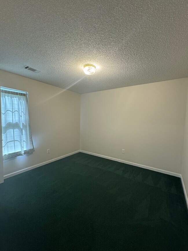 Building Photo - Spacious 4-Bedroom Home on Large Corner Lo...