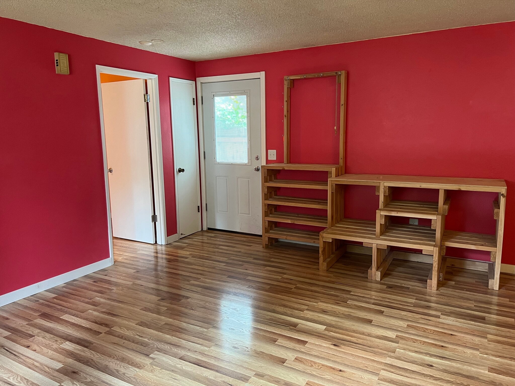 Living room, looking at front door. On the left is door to orange bedroom. - 1618 Groves Ave NW