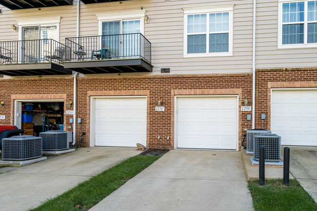 Garage access from the rear side of the property, additional open parking available too - 22785 Settlers Trail Terrace