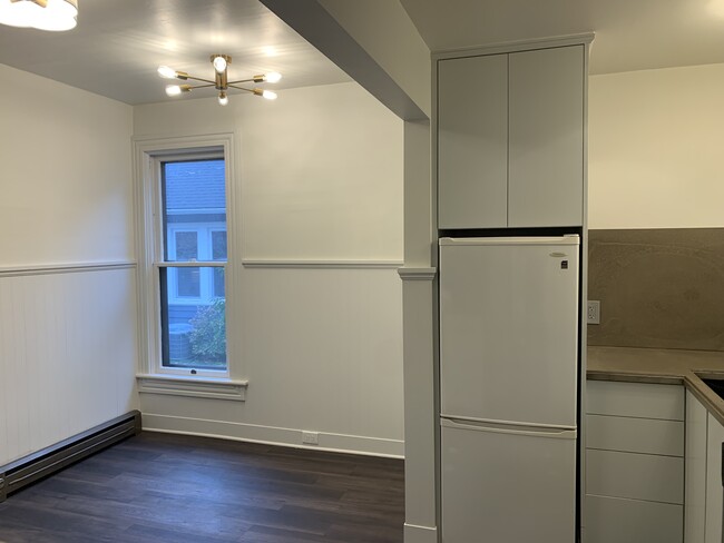 Kitchen with nook near window. - 1023 SE Bidwell St