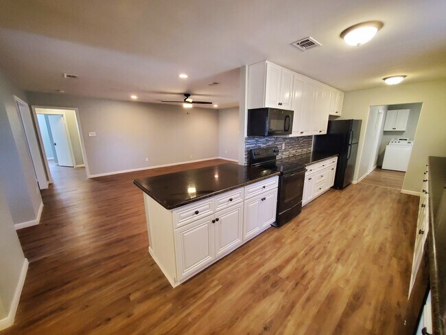 Stove/oven, microwave, and refrigerator are all provided. - 37438 Meadowview Dr