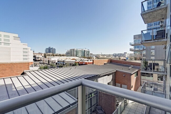 Building Photo - Modern Downtown Condo in Premier High-Rise...