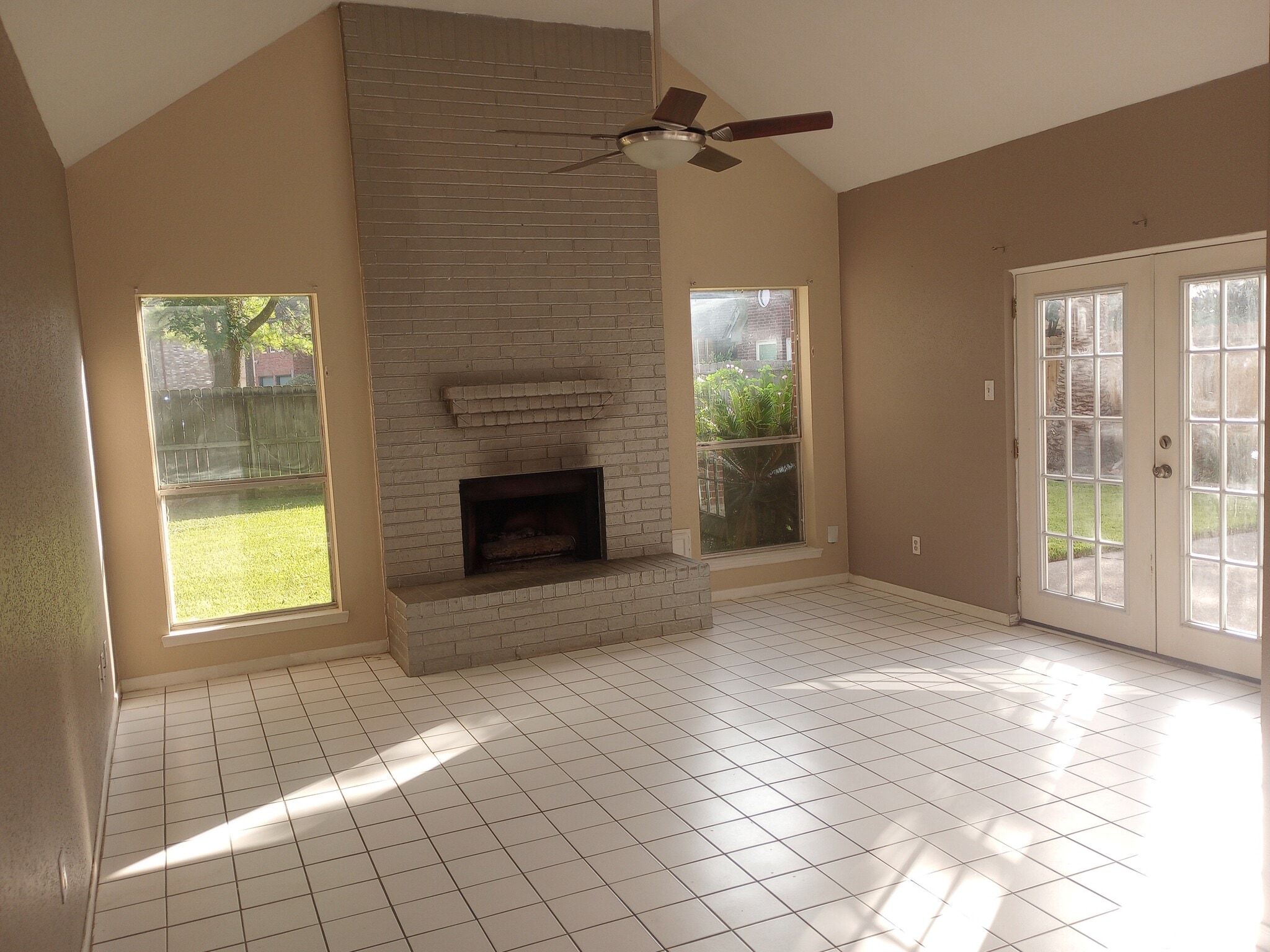 Den with vaulted ceilings, patio outside french doors - 14611 Sun Harbor Dr