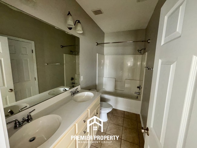 Building Photo - Charming 3BR Tuscaloosa Home | Hardwood Floors, Brick Fireplace, 2-Car Garage & Fenced Yard