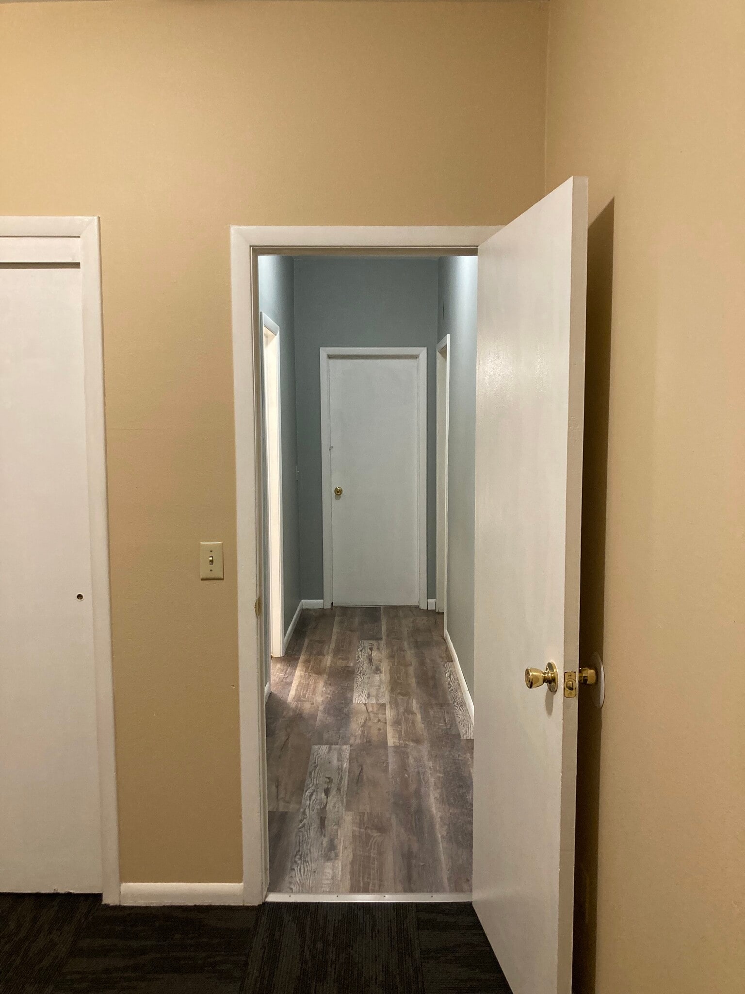 Hallway to laundry, bath, and bedroom 2 - 116 2nd St E