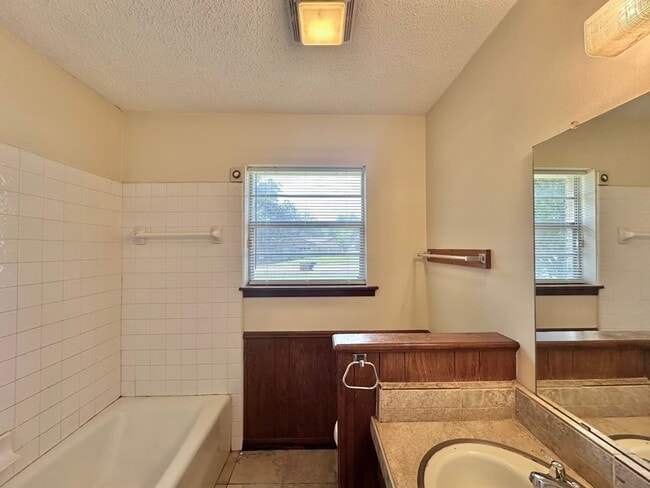 Building Photo - Spacious 4-Bedroom Home on a Corner Lot wi...