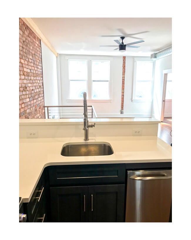 Kitchen overlooks the living area, perfect for entertaining. - 18 W State St