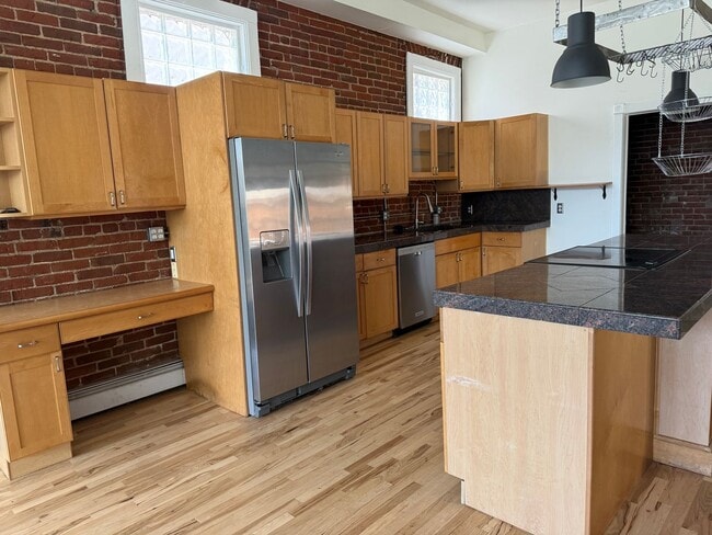 Building Photo - Located in the Historic Baker District, this uniquely converted warehouse features updates throug...