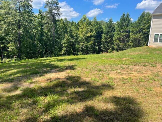 Building Photo - Available Now – Spacious 4BR Home on 1.5 Acres in Rural Hall!