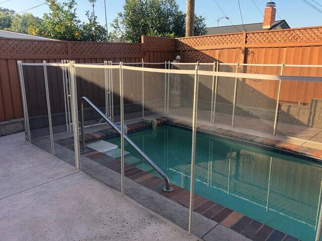 Building Photo - 4bd/2ba - Bedroom Home with a Lap Pool! Excellent Location - Coming Soon!