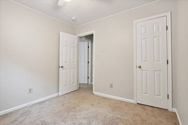 The home offers three spacious bedrooms! - 1644 Skiffes Creek Cir