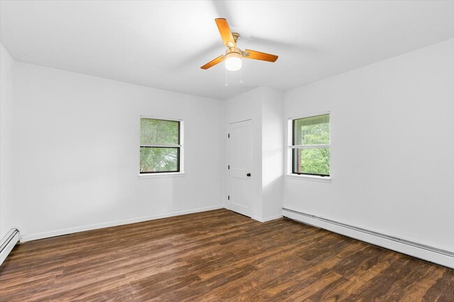 Bedroom on the first floor that could be use as an office room. Has a closet and two windows. - 45 High St