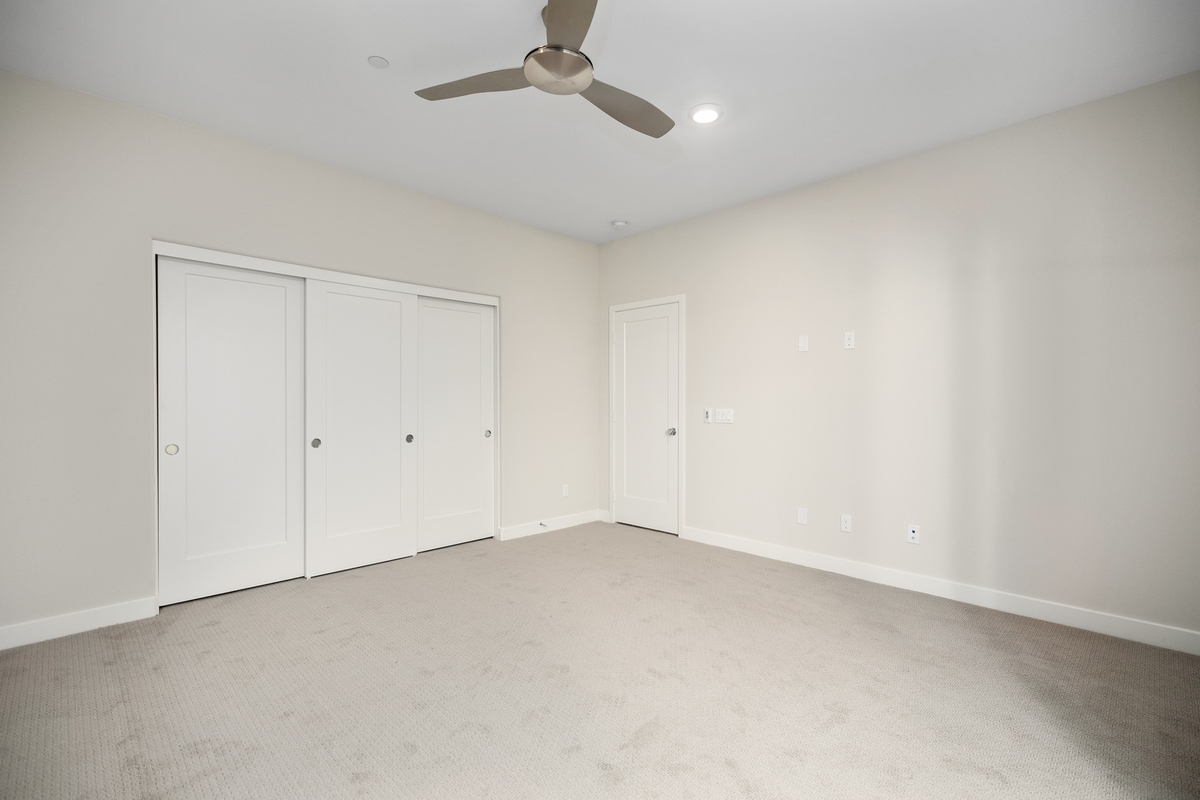 First floor large bedroom view to entrance door - 590 Catalonia