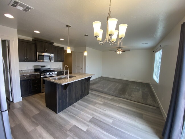 Building Photo - "Spacious 4-Bedroom Townhouse Retreat on S...