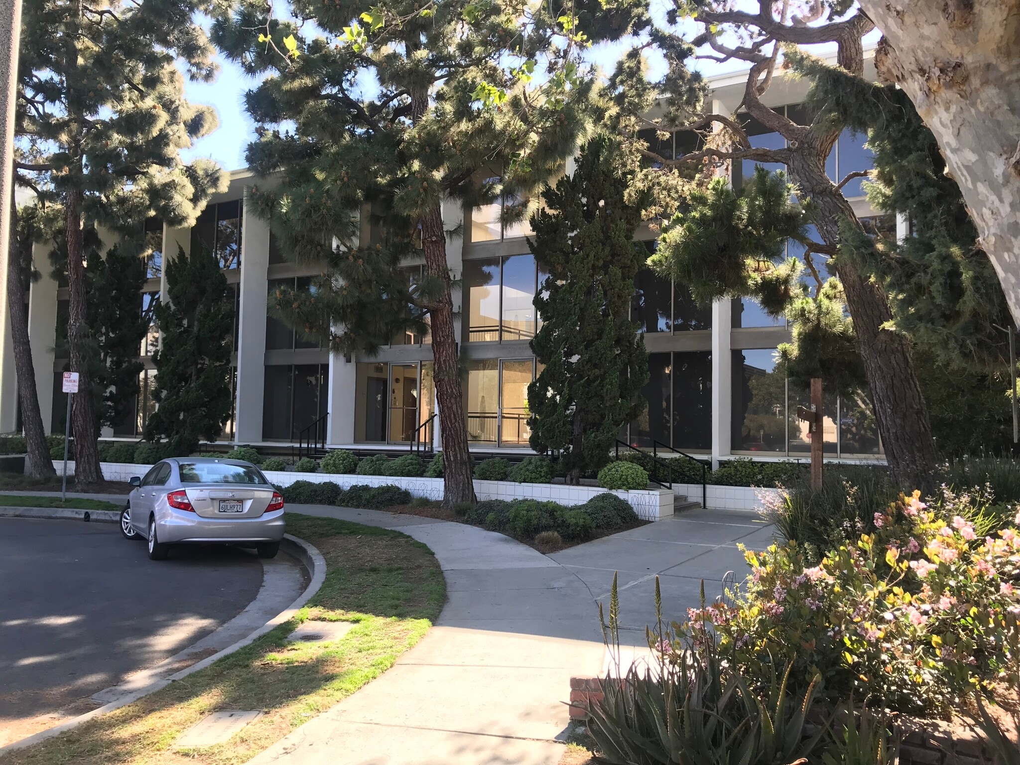 Three story building; on street and assigned garage parking - 8701 Delgany Ave