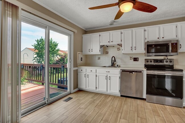 Building Photo - Spacious 4-Level Home with Deck, Workshop ...