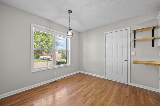 Building Photo - Charming Brick Home with Soaring Ceilings & Updated Finishes!