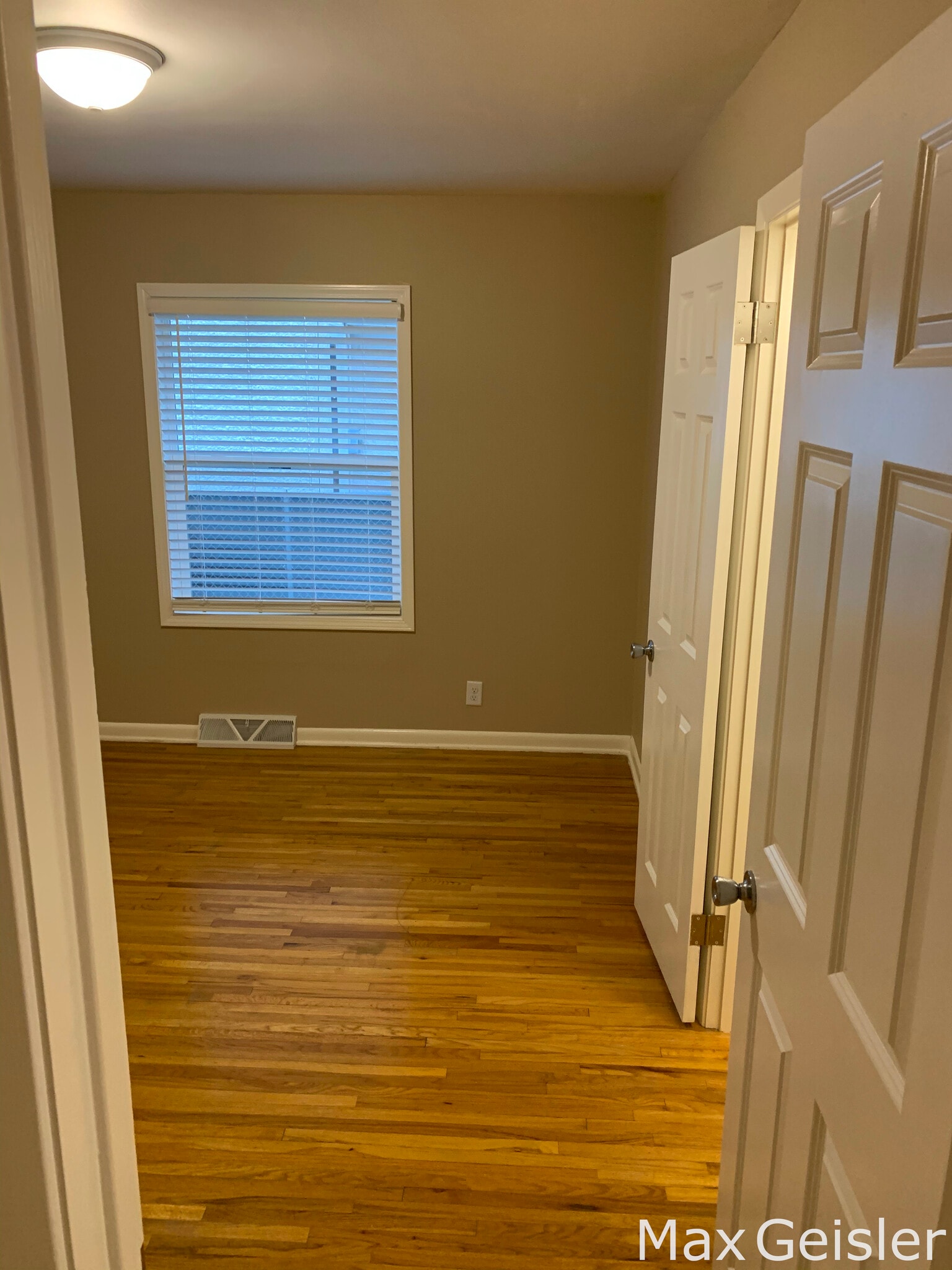 First bedroom with lit closet. - 404 12th Ave N
