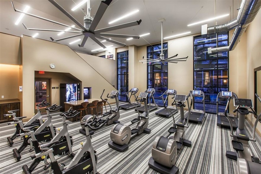 Two-level fitness center features cardio studio - The Verdant Apartments