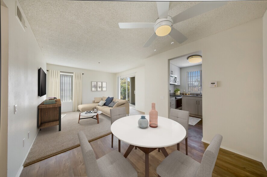 Renovated Package Dining area with hard surface plank flooring and living room with carpet - eaves La Mesa