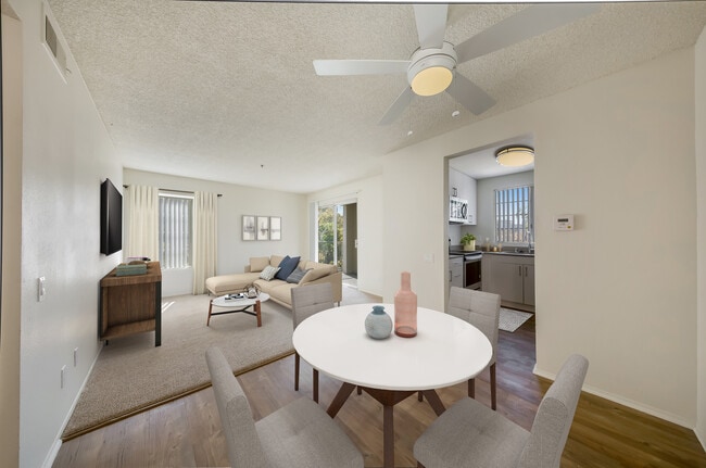 Renovated Package Dining area with hard surface plank flooring and living room with carpet - eaves La Mesa