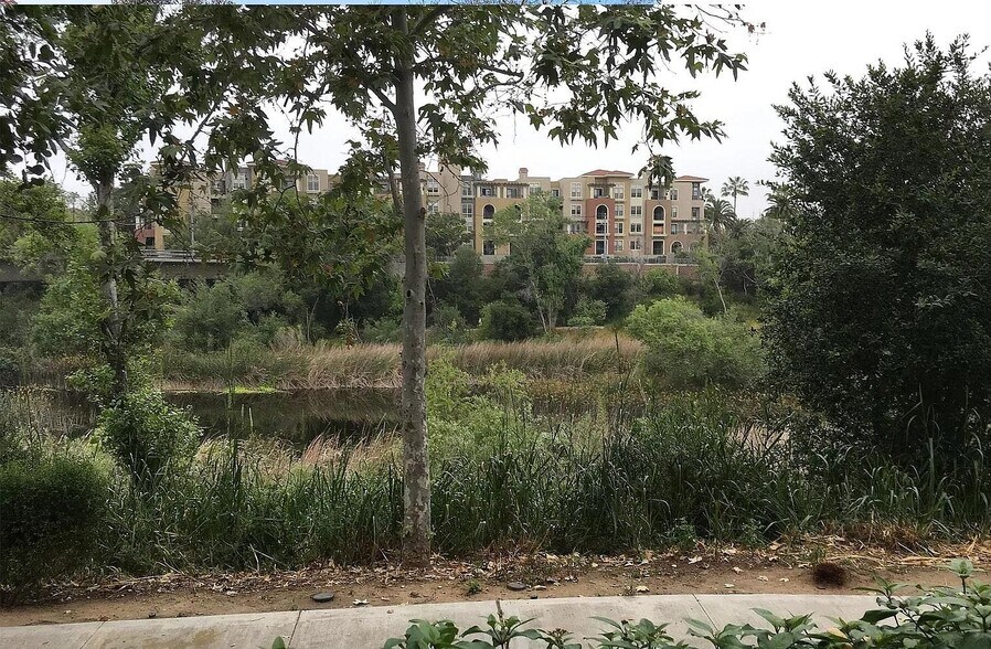 View of trolley stop across the San Diego river - 1950 Camino De La Reina