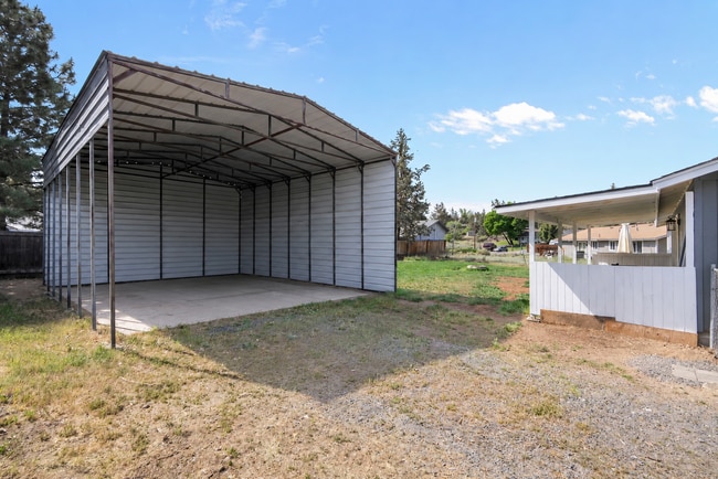Building Photo - Charming 3-Bedroom Bend Home on 1/2 Acre with Expansive Yard, Mature Trees & Covered RV/Boat Storage