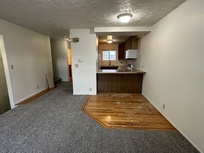 Building Photo - Spacious, three level, 4 Bed 2.5 bath Townhome in Ammon right behind the Walmart on Hitt.