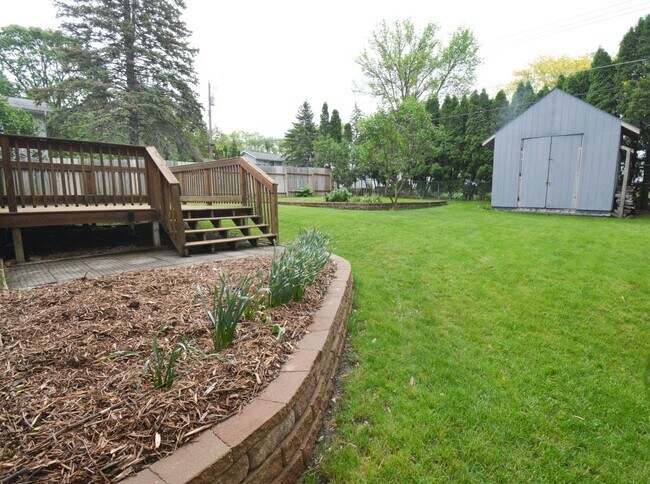 Building Photo - Beautiful multi-level with Gorgeous Yard and LOTS of Storage!