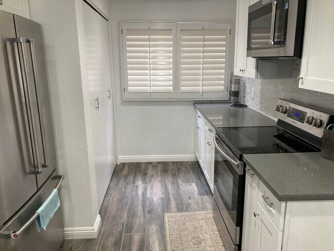 Building Photo - Beachside Furnished Retreat! Remodeled 2BD/2BA Condo Steps from the Sand!