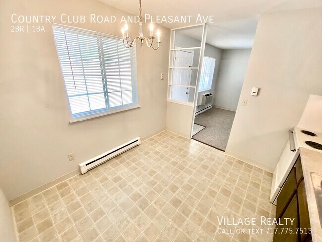 Building Photo - Roomy 2-bed end-unit w/ on-site laundry & ...