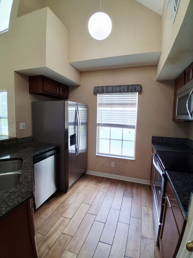 Building Photo - Water view condo with garage in sought after westchase