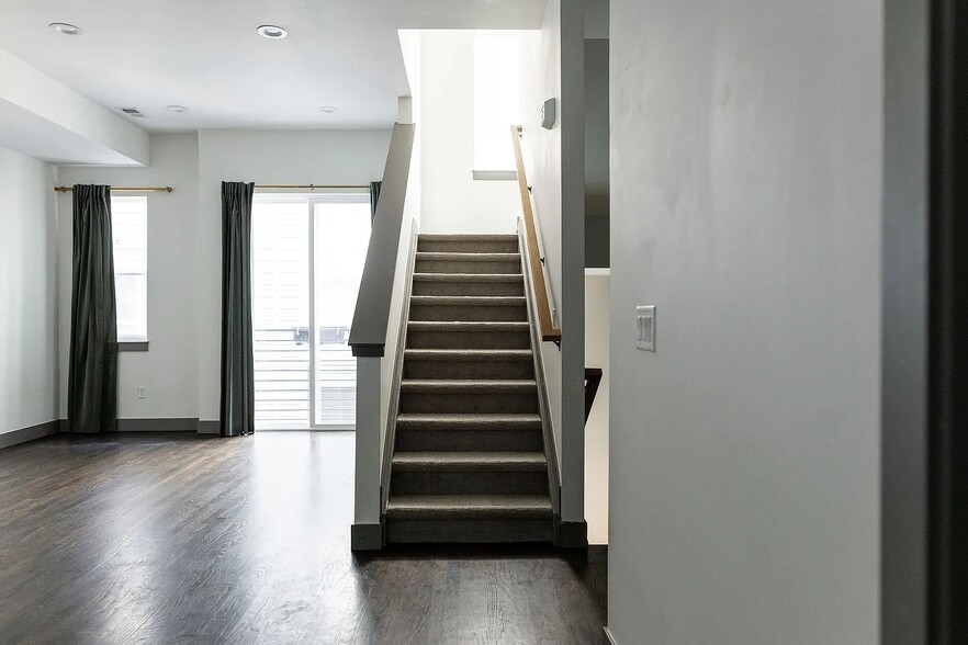 Living Room with stairs to the mudroom and up to the bedrooms - 3505 S Marion St