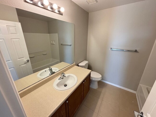 Building Photo - Spacious Tri-Level 4-Bedroom Home with Bal...