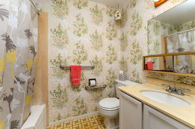 Building Photo - Lakeside, fully furnished, two bedroom, one bath townhome with enclosed garage.