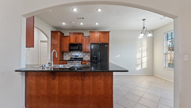 Building Photo - Charming 4-Bedroom Fayetteville Retreat with Granite Accents & Warm Fireplace!