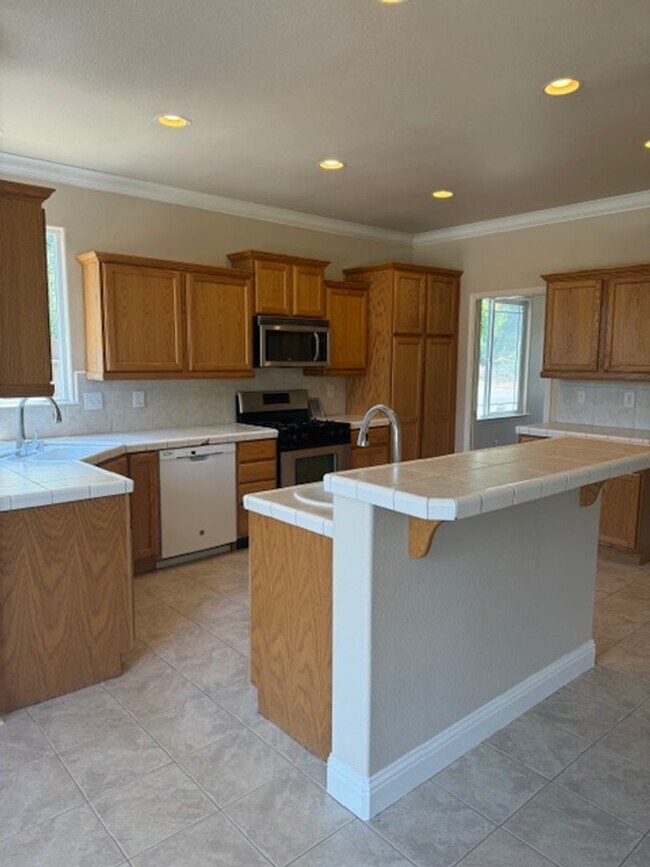 Building Photo - Enterprise Neighborhood 3 Bedroom Home with bonus room and 3 car garage- Landscaping Included!