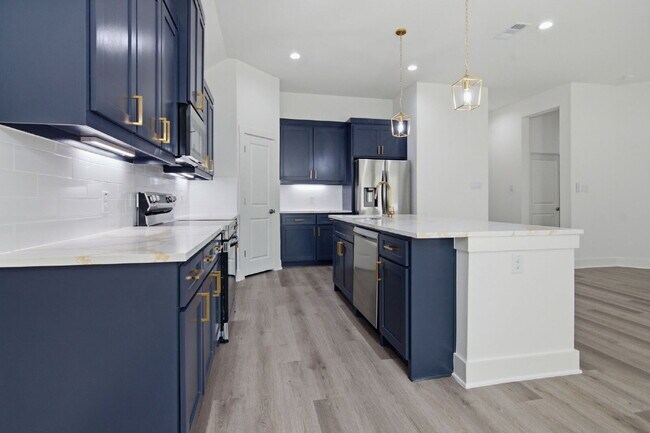 Building Photo - "New Construction 3-2-2 Home with Designer Touches Throughout!"