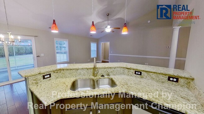 Building Photo - Beautiful home boasts open floorplan, screened porch, and spacious fenced yard