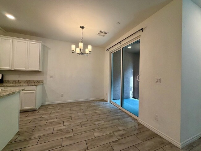 Building Photo - GATED 3 BED 2.5 BATH TOWNHOME WITH 2-CAR GARAGE, COVERED PATIO & COMMUNITY POOL