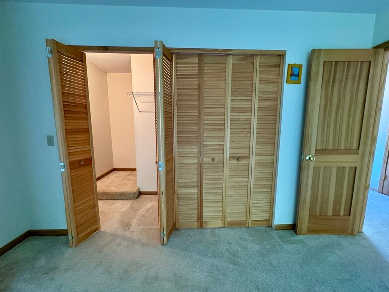 Double closet with wall in storage - 113 Penny Ln