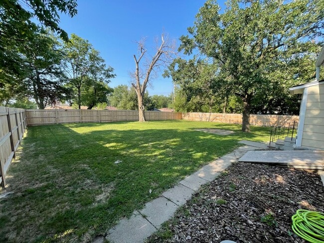 Building Photo - New Appliances + HUGE Fenced Backyard