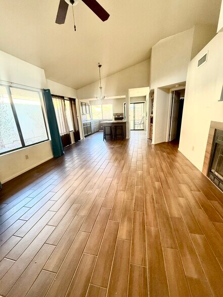 Living room and kitchen with wood fireplace - 200 E Belcourte Pl
