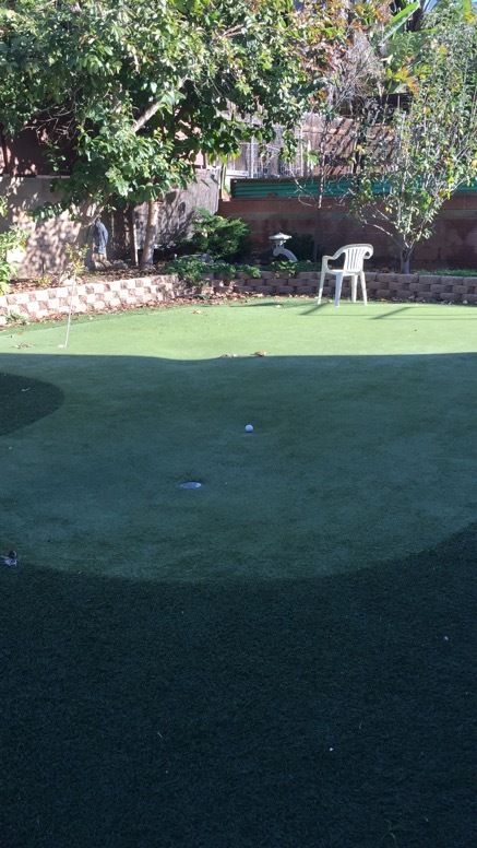 Golf putting in back yard - 923 6th St