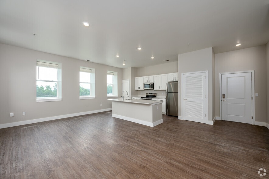 2BR, 2.5BA - 1,561SF - Living Room/Kitchen - The Assumption on Blaine