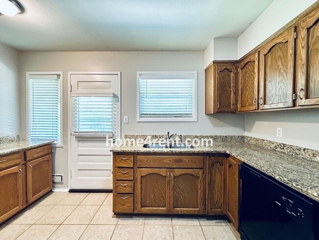 Building Photo - Attractive Prairie Village Ranch w/ FRESH PAINT, Wood Floors, Granite Counters and a Fenced Yard!