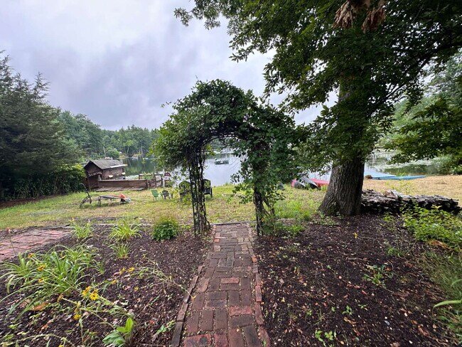 Building Photo - Peaceful Waterfront Living: 2-Story Home on River Road with Ample Outdoor Storage & Water Extras!