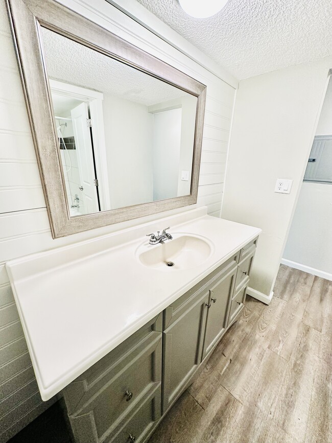 Experience luxury with this stylish and functional bathroom vanity. - Hawk Point Apartments