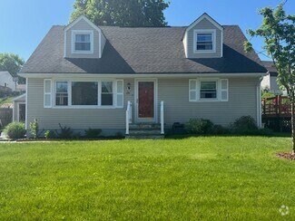 Building Photo - Sunny, Modern Mid-Century Cape 4 BR Spacio...