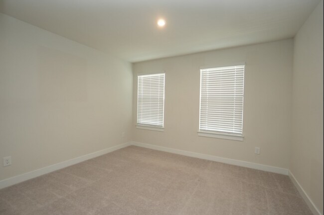 Building Photo - This wonderful home has a covered rocking chair front porch